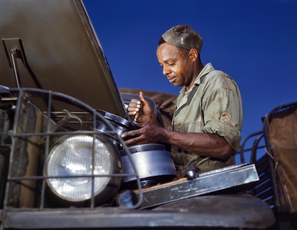 Photo showing: Army Service -- June 1942. Fort Knox, Kentucky. Cleaning the air filter of an Army truck.