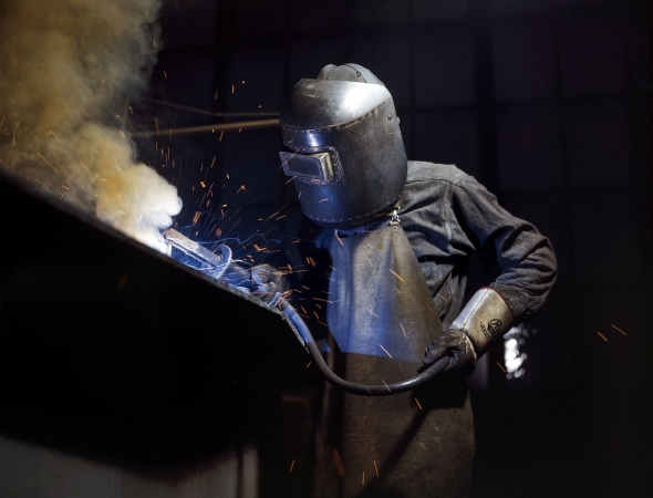 Photo showing: Making Sparks Fly -- June 1942. Boiler welder at Combustion Engineering in Chattanooga, Tennessee.  