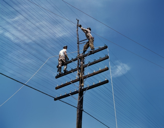 Photo showing: High Voltage -- June 1942. Power transmission and utility lines, TVA hydroelectric plant at Chickamauga or Douglas Dam, Tennessee.