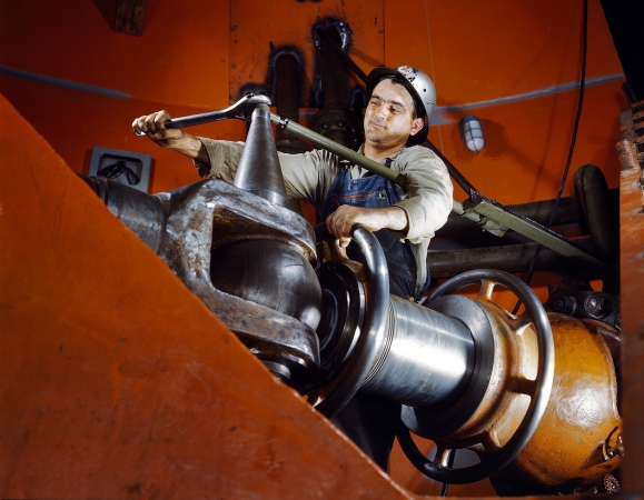 Photo showing: Tightening a Nut -- June 1942. Tightening a nut on a guide vane servomotor in the TVA hydroelectric plant at the Watts Bar Dam.