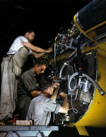 Photo showing: Big Bird With All the Trimmings -- July 1942. Wiring a junction box on the firewall a B-25 bomber, North American Aviation plant, Inglewood, California.