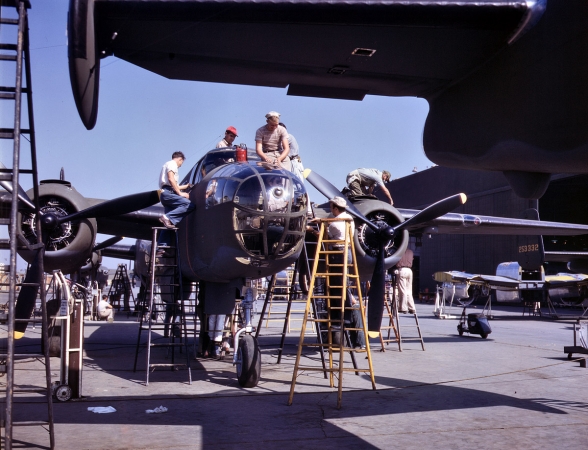 Photo showing: The Finishing Touches -- October 1942. Final assembly for a B-25 bomber at North American Aviation, Inglewood, Calif.