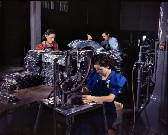 Photo showing: Marking Parts -- Numbering machine marking parts in No. American Aviation's sheet metal department, Inglewood, Calif., October 1942.