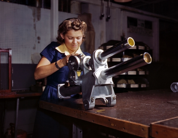 Photo showing: Doing Her Part: 1942 -- Working over the landing gear mechanism of a P-51 fighter plane. North American Aviation, Inglewood, California.
