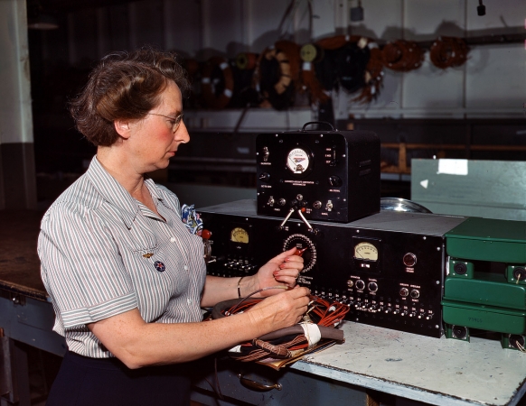 Photo showing: Testing, Testing: 1942 -- Testing electric wiring at Douglas Aircraft Company, Long Beach, California.