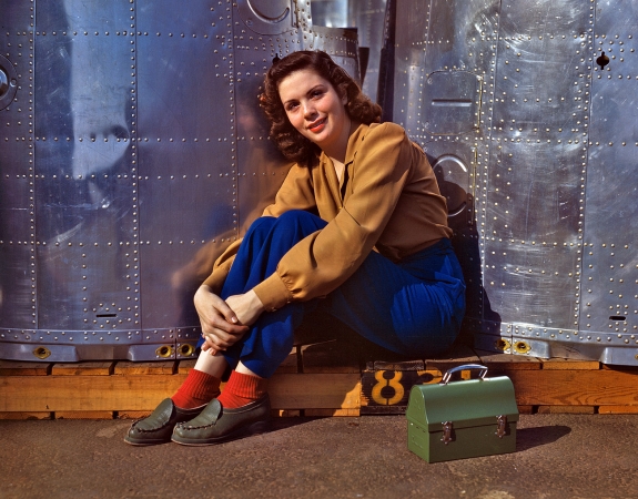 Photo showing: Rosie Takes a Break -- Noontime rest for an assembly worker at the Douglas Aircraft Company Long Beach, Calif. plant, October 1942.