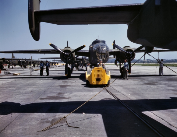 Photo showing: B-25: 1942 -- New B-25 bomber is brought for a test hop to the flight line at the Kansas City, Kansas, plant of North American Aviation.