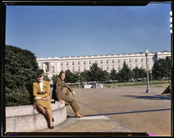 Photo showing: War Games: 1943 -- A soldier and a woman in a park, with the Old [Russell] Senate Office Building behind them.