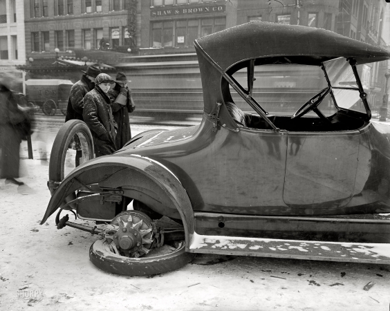 Photo showing: Broke His Spokes -- Washington, D.C., circa 1917. Dr. W.J. Davis, disabled auto. The car is a Kissel.