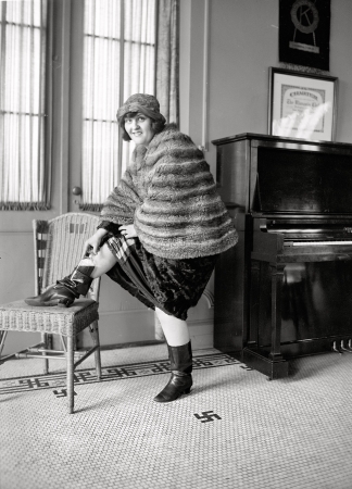Photo showing: A Touch of Flask -- January 21, 1922. Washington, D.C.  'Boot leg.' Woman taking flask from her Russian boot.