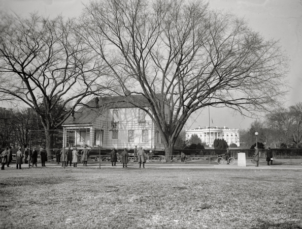 Photo showing: Moving Day: 1924 -- Home Sweet Home being moved to its permanent location, passing the south grounds of the White House.