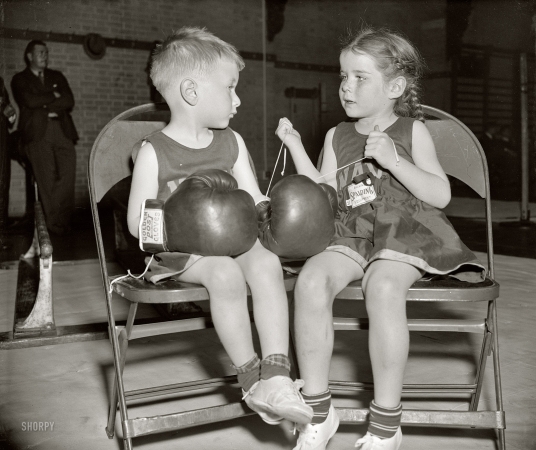 Photo showing: And So It Begins -- April 15, 1939. Annapolis, Maryland. Naval Academy's 20th Annual Junior Boxing Championships.