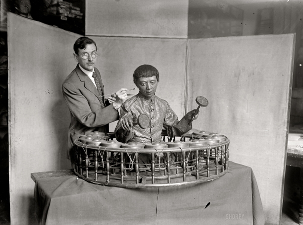 Photo showing: A Different Drummer -- Preparator William H. Egberts with an exhibit for the National Museum in Washington, 1925.