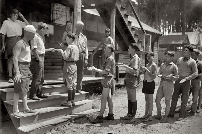 Photo showing: A Show of Hands -- July 9, 1925. Boys Scouts at Camp Roosevelt.