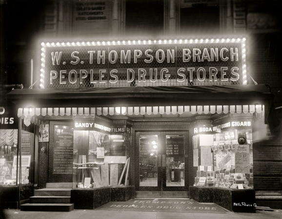 Photo showing: Bright Lights, Big City -- Circa 1920. People's Drug Store, 15th & G Streets N.W., Washington.