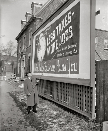 Photo showing: The Tax Clock: 1939 -- First of 25,000 such signs, part of a drive for reduction in taxes by the U.S. Chamber of Commerce.