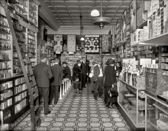 Photo showing: Busy Drug Store -- Washington circa 1920. People's Drug Store, interior, 14th and U streets.