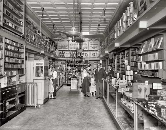 Photo showing: The Home of Low Prices -- Washington, D.C., 1920 or 1921. People's Drug Store, 804 H Street N.E. Also: full line of rubber goods.