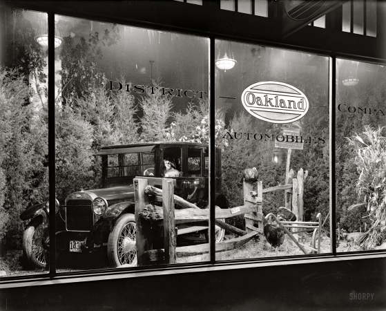 Photo showing: Drive-Thru Window -- A showroom display at District Oakland Co., 1709 L Street N.W. in Washington, circa 1921.