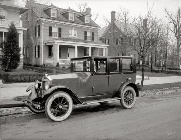 Photo showing: Here Comes the Neighborhood -- In his circa 1921 Velie Six, the residential developer D.J. Dunigan with some of his creations.