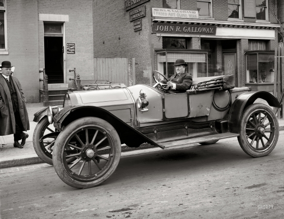Photo showing: Big Wheels -- James Kelly, we're informed, in a circa 1911 Cole Model 30 somewhere in Washington, D.C.