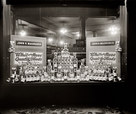Photo showing: Canned Food Bonanza -- Magruder Grocery at Connecticut Avenue and K Street in Washington, circa 1925.