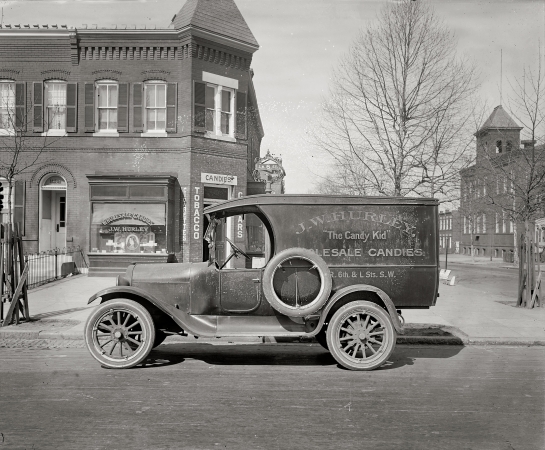 Photo showing: The Candy Kid -- Washington, Sixth and L streets S.W., circa 1926. Semmes Motor Co. J.W. Hurley truck.