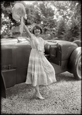 Photo showing: A Fond Farewell -- Circa 1920. Stage and film actress Grace Valentine and her Packard Twin Six roadster.