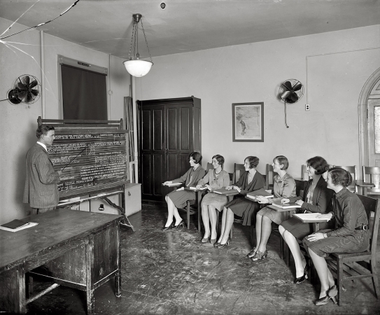 Photo showing: Telco Girls -- Washington, 1928. Chesapeake & Potomac Telephone girls in class laughing.