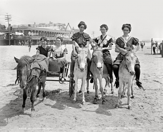 Photo showing: Hoofing It at the Beach -- Atlantic City circa 1905. In the background: Clabby's baths on the boardwalk.