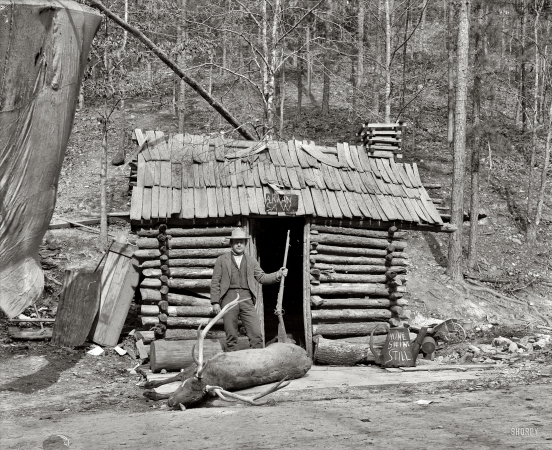 Photo showing: Happy Hollow -- Hot Springs, Arkansas, circa 1901. McLeod's cabin, Happy Hollow.
Possibly associated with Norman E. McLeod, photographer, and menagerie.