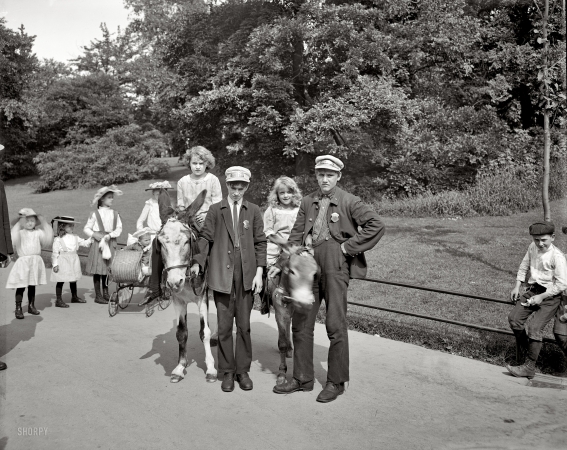 Photo showing: Central Park Donkey Boys -- New York City circa 1904. Their Parks Department badges identify them as Donkey Boys 1 and 2.