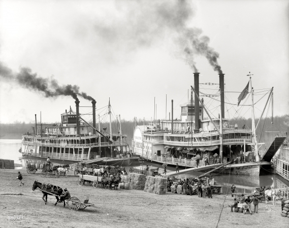 Photo showing: Mississippi River Landing -- Circa 1906. Sternwheeler Belle of Calhoun and sidewheeler Belle of the Bends taking on cargo at Vicksburg.