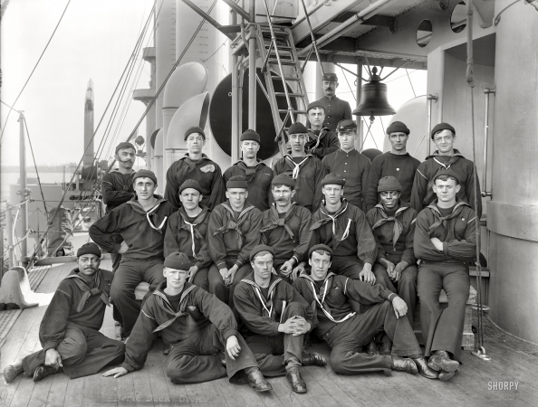 Photo showing: In the Navy -- Circa 1896-1899. Berth deck cooks aboard cruiser U.S.S. Brooklyn.