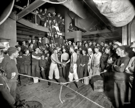 Photo showing: And Come Out Swinging -- Aboard the U.S.S. Oregon circa 1897. Shake hands. Note the tattoo art.
