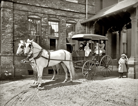Photo showing: A Family Spin -- Circa 1900. Admiral Sampson's family. Young relatives of William T. Sampson, a hero of the Spanish American War.