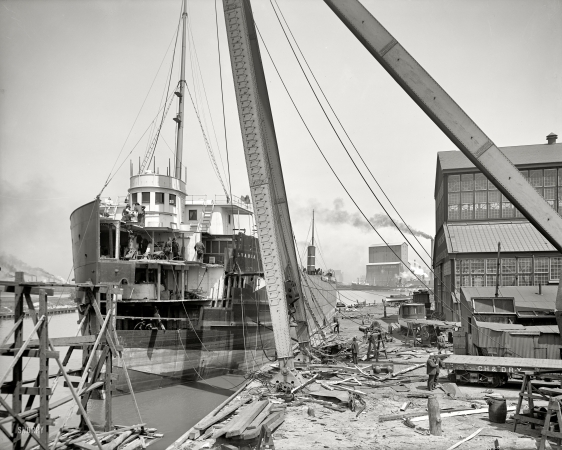 Photo showing: Take a Bow -- Chicago Ship Building Co. Repairing a lake carrier after a collision, circa 1905.