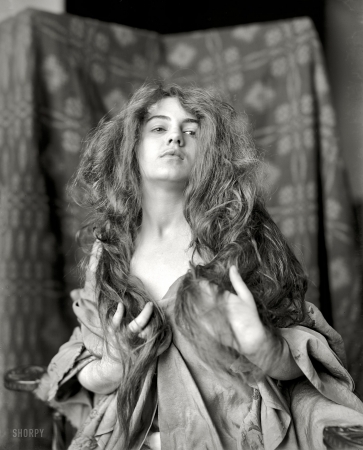 Photo showing: The Nubile Savage -- Circa 1900. Model, hair down.