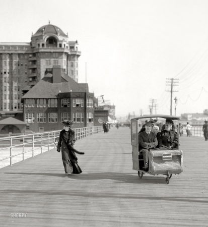 Photo showing: Rolling on the Boardwalk: 1906 -- Rolling chair on the Boardwalk, Atlantic City.