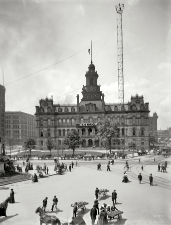 Photo showing: Welcome to Detroit -- City Hall and Campus Martius circa 1900. Rising to the right is one of the city's moonlight tower carbon-arc lamps.