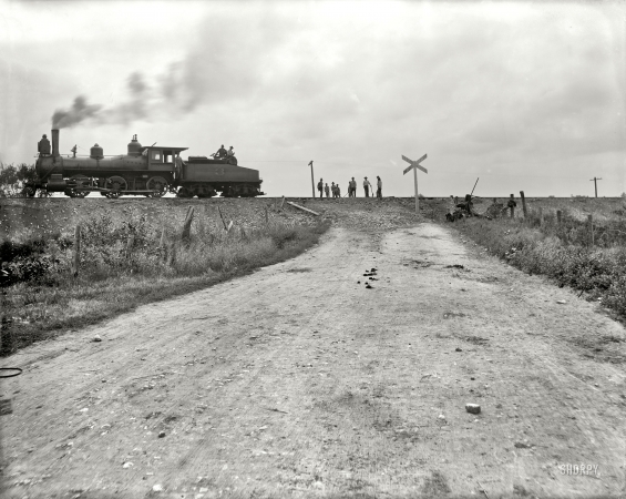 Photo showing: All the Livelong Day -- Joliet, Illinois, circa 1901. Chicago & Alton Railroad. Track elevating at grade crossing.