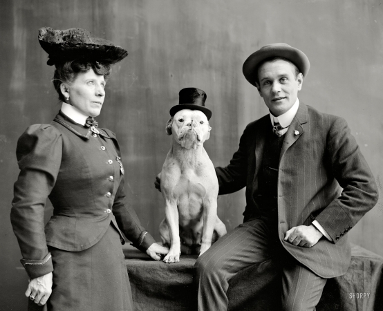 Photo showing: Bringing Up Bobbie -- Circa 1908. Mr. and Mrs. Frank Kern and trained dog Bobbie.