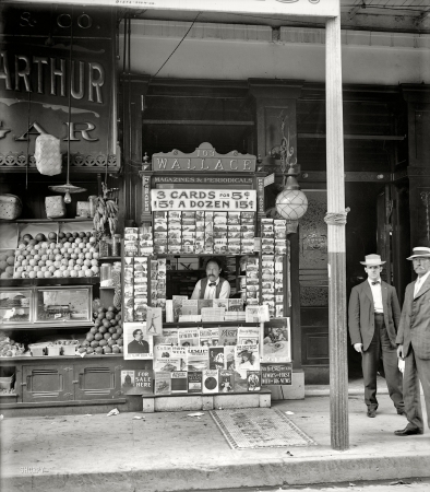 Photo showing: Mr. Magazine -- 1908. Smallest news & post card stand in New Orleans, 103 Royal Street.