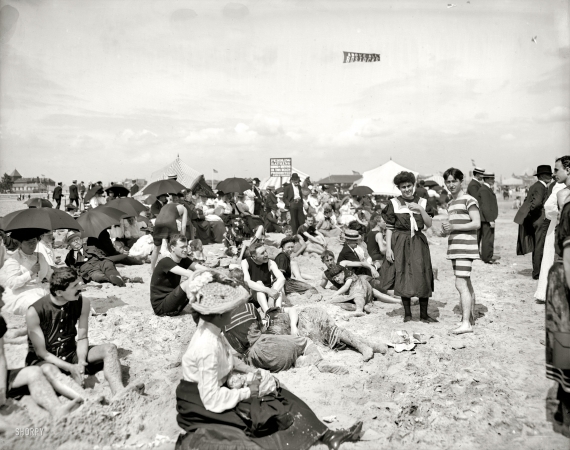Photo showing: Sand, Sea and More Sand -- Coney Island, New York, circa 1904. Getting their picture took.