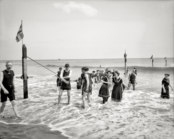 Photo showing: Splash -- Coney Island, New York, circa 1905. Surf bathing.