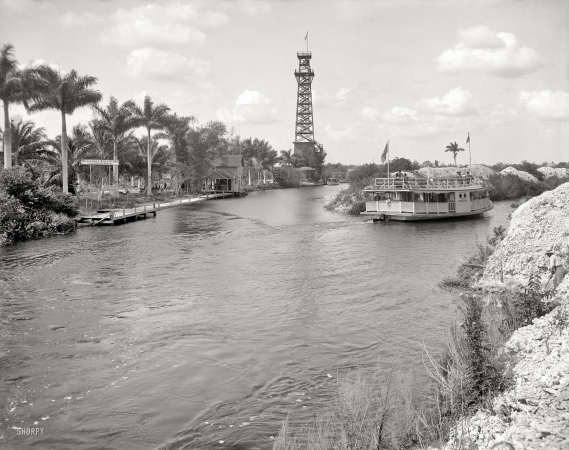 Photo showing: Car Dale Tower -- Miami circa 1912. Cardale Tower and Musa Isle Fruit Farm, Miami River. Steamer Lady Lou.