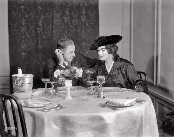 Photo showing: A Handsome Couple -- Circa 1915. Couple at champagne supper. The stage actor Julian Eltinge (right) and friend.