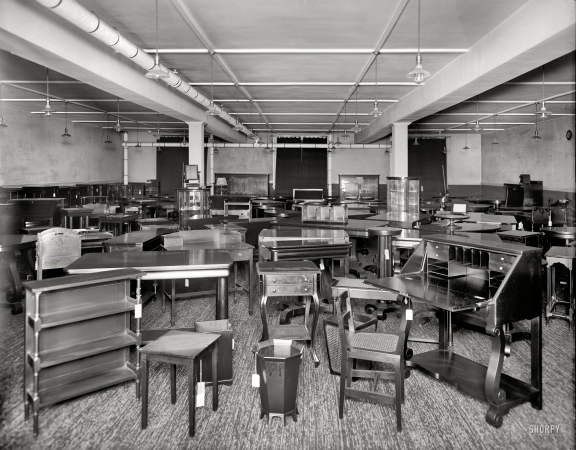 Photo showing: Furniture City -- -- Detroit, Michigan, circa 1912. Pringle Furniture Co. showroom with tables and miscellaneous furniture.