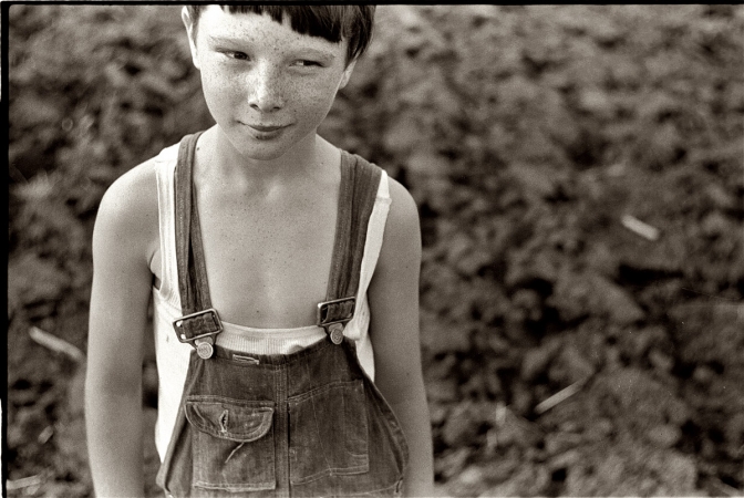 Photo showing: Iowa Farm Boy -- May 1940. Young boy at Granger Homesteads, Iowa. His father is a miner.