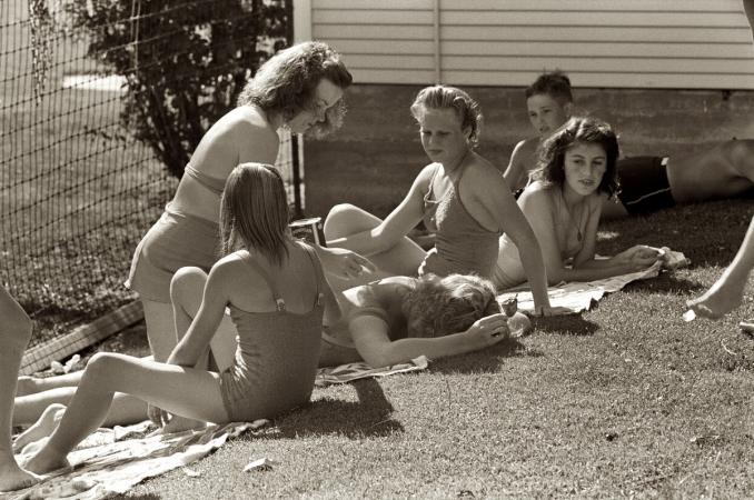 Photo showing: The Summer of 41 -- July 1941. Caldwell, Idaho. Sun bathers at the park swimming pool.